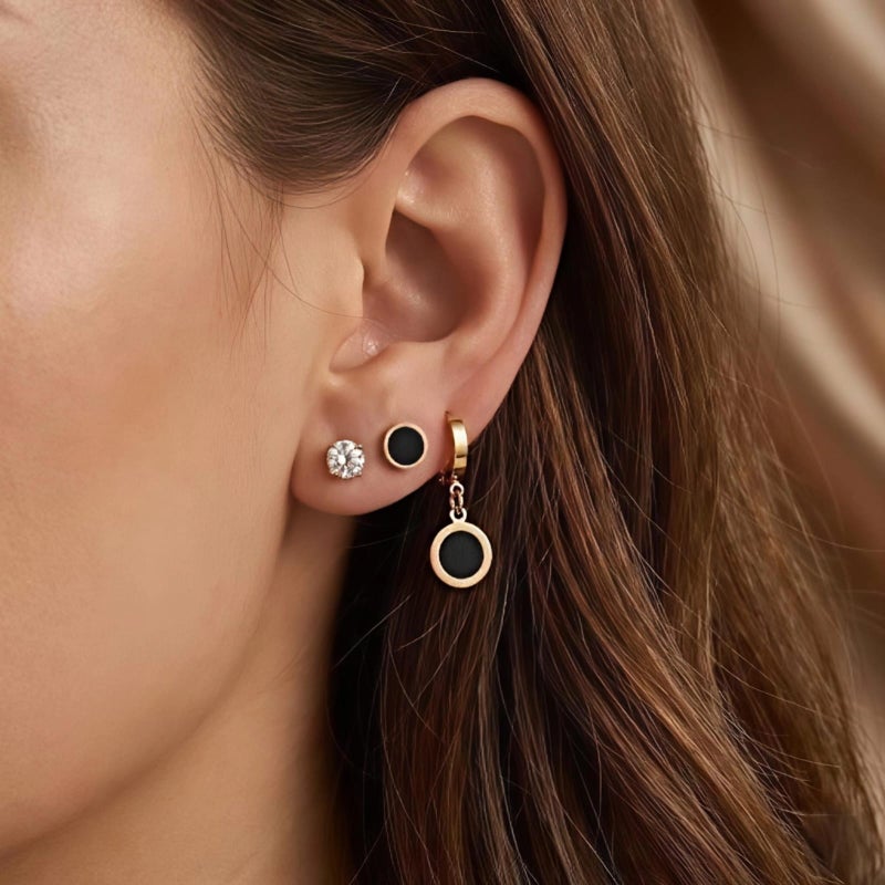 A set of three pairs of exquisite gold earrings: sparkling zircon studs, striking black posts, and luxurious black dangling circles. Crafted from durable stainless steel, a captivating and perfectly harmonious combination. - Image 3